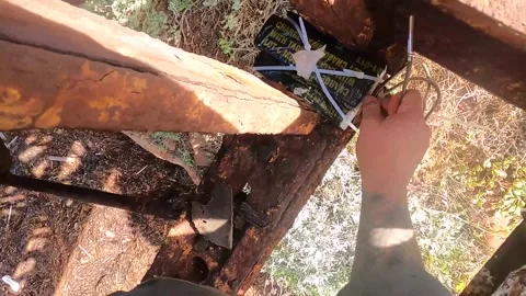 U.S. Marines inserting fuse wire into M112 explosives for demolition of bridge Stock Footage 261512628