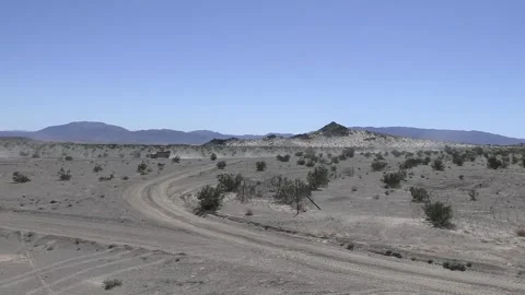 U.S. Marines Joint Light Tactical Vehicle being driven through desert terrain Stock Footage 266894042