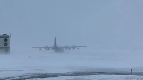 U.S. Marines KC-130 Super Hercules taxiing in blizzard conditions Stock Footage 269901943
