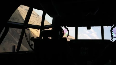 U.S. Marines KC-130 Super Hercules pilot low level flying through mountains Stock Footage 282784408