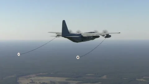 U.S. Marines KC-130J Super Hercules in flight with refueling drogues extended Stock Footage 218826523
