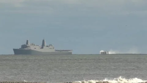 U.S. Marines LCAC moving alongside transport dock U.S. Navy USS New York LPD-21 Stock Footage 258451697