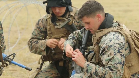 U.S. Marines load bullets into magazines for Exercise Bougainville I  動画素材 93692154