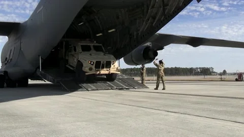 U.S. Marines load Mine Resistant Ambush Protected Vehicle onto C-17 Globemaster Stock Footage 229618281