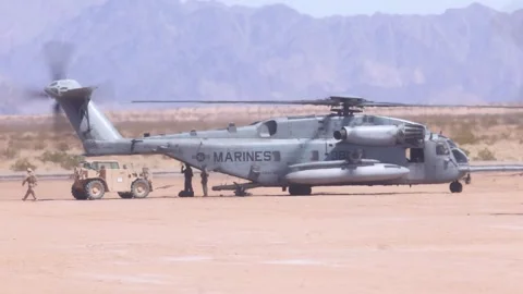 U.S. Marines loading CH-53 Super Stallion helicopter Stock Footage 334835305