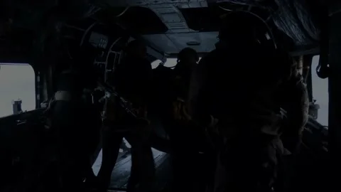 U.S Marines off-loading combat rubber raiding craft in to sea from CH-47 Chinook Video stock 224488730