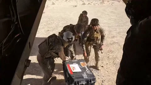 U.S. Marines off-loading crates from rear of MV-22 Osprey Stock Footage 233255829