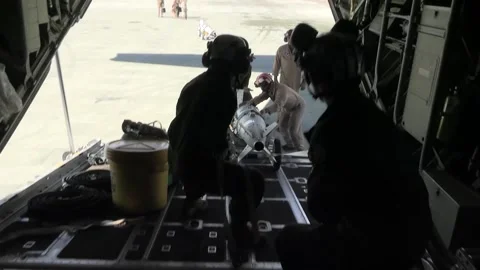U.S. Marines off-loading Guided Bomb Unit from KC-130J Super Hercules Stock Footage 264288268