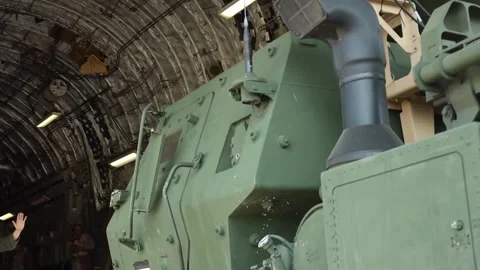 U.S. Marines off-loading a HIMARS from U.S. Air Force C-17 Globemaster aircraft Video stock 284217697