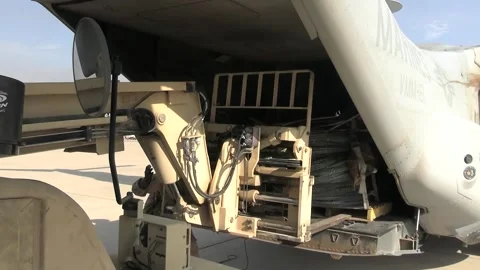U.S. Marines loading pallet of razor wire onto MV-22 Osprey for border wall Stock Footage 300261131