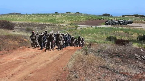 U.S. Marines march uphill during basic training exercises. Video stock 74810074