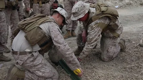 U.S. Marines measuring metal posts to attach to the Mexican border fence Stock Footage 300261130