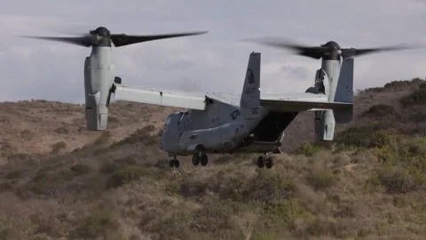U.S. Marines MV-22 Osprey landing in scrubland Video stock 256972234