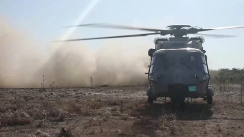 U.S. Marines MV-22 Osprey touching down near Italian Navy NH-90 helicopter Stock Footage 280747983