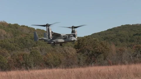U.S. Marines MV-22 Osprey touching-down on scrubland Stock Footage 292972248