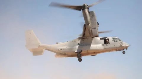 U.S. Marines MV-22 Osprey creates sandstorm during flight Stock Footage 334835326