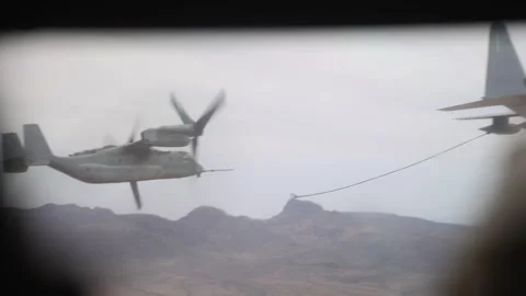 U.S. Marines MV-22 Osprey approaching drogue during aerial refuelling operations Stock Footage 334835384