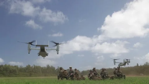 U.S. Marines MV-22 Ospreys departing after delivering soldiers by air insertion Stock Footage 294680041