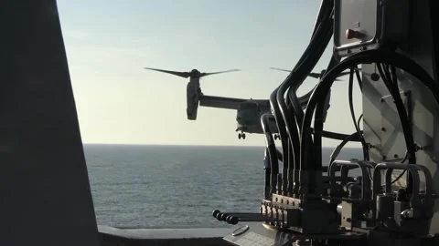 U.S. Marines MV-22B Osprey approaching USS New York to land Stock Footage 255645727