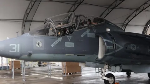 U.S. Marines pilot and co-pilot closing cockpit doors on AV-8B Harrier II Stock Footage 263112185