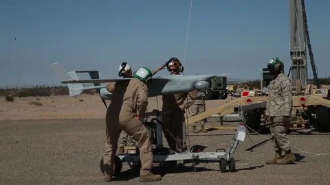 U.S. Marines placing RQ-21A Blackjack UAV onto transportation trolley Stock Footage 213923300