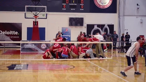 The U.S. Marines play the U.S. Navy in a game of seated volleyball. Stock Footage 74810965