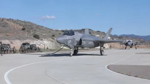 U.S. Marines refuel two F-35B Lightning II at Forward Arming Refuelling Point Stock Footage 227138625