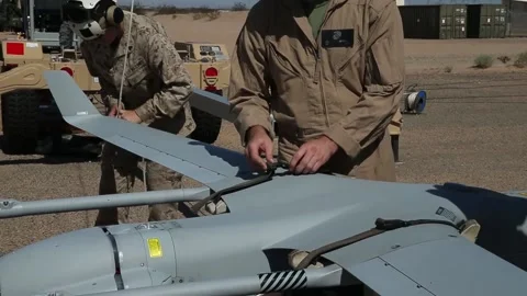 U.S. Marines securing RQ-21A Blackjack UAV onto transportation trolley Stock Footage 213923306