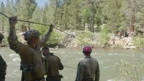 U.S. Marines setting up rope river crossing Stock Footage 277686469