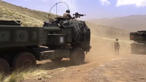 U.S. Marines walking with M142 High Mobility Artillery Rocket Systems  Stock-Footage 201928311