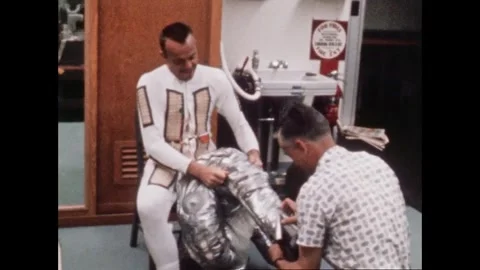 U.S. Mercury Program astronaut Lt. Comdr. Alan B. Shepard Jr suiting up Stock Footage 263292178