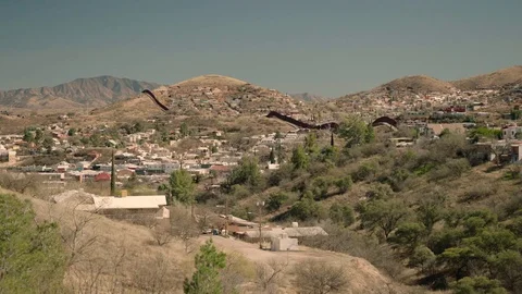 U.S. - Mexican Border cutting through city Stock Footage 72629491