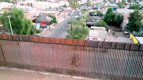 US-Mexico Border Aerials in Tecate California and Tecate Mexico Stock Footage 153053381