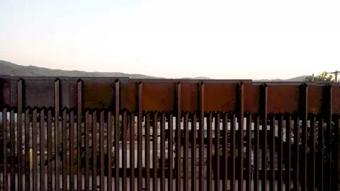 US-Mexico Border Aerials in Tecate California and Tecate Mexico Stock Footage 153059165