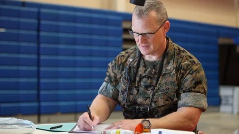 U.S. Military medic completing paperwork Stock Footage 107598326