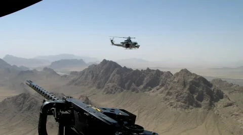 US military Super Huey flying over Afghanistan Stock Footage