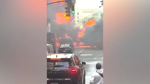 US: MOMENT - Vehicle explodes near Charging Bull statue in New York Stock Footage 335253585