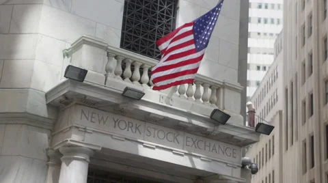 U.S. national flags wave at the New York Stock Exchange at the Wall Street Stock Footage 50522408