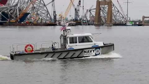 U.S. Naval Sea Systems Command boat travelling near Key Bridge collision site Video stock 273563151