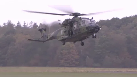 US Navy Apache helicopter lands, aboard marines Stock Footage 120948763