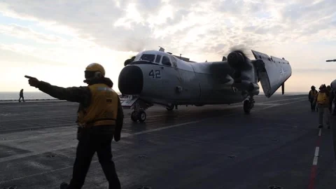 U.S. Navy C-2A Greyhound taxiing with wings closed aboard USS Harry S. Truman Stock Footage 289992403