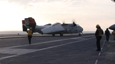 U.S. Navy C-2A Greyhound turning on flightdeck of USS Harry S. Truman (CVN 75) Stock Footage 289992405