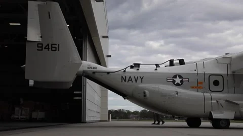 U.S. Navy CMV-22B Osprey reversing into hangar at Naval Station Norfolk Stock Footage 271233749