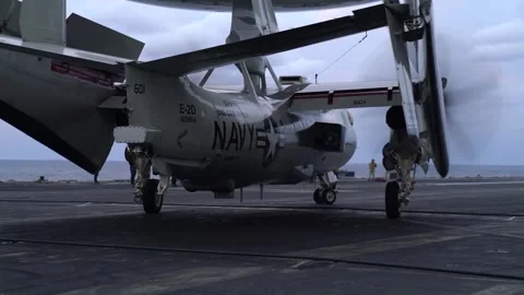 U.S. Navy E-2D Advanced Hawkeye turning with wings folded aboard USS Carl Vinson Video stock 297744293