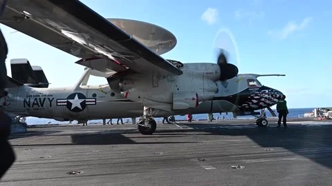 U.S. Navy E-2D Hawkeye unfolding wings prior to launch from USS Carl Vinson Stock Footage 279968369
