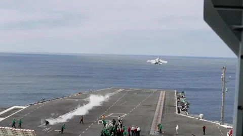 U.S. Navy F/A-18 Super Hornet launches from USS Abraham Lincoln CVN 72 Stock Footage 254557857