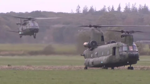 US Navy Helicopter Apache and Chinook land Stock Footage 120948762
