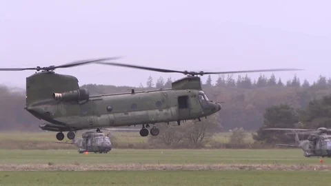 US Navy Helicopter Apache and Chinook take off with the marines on board Video stock 120948765