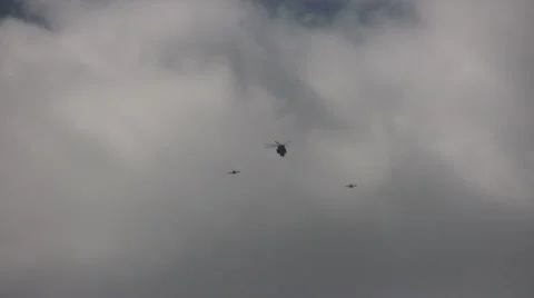 US Navy helicopter escorted by two airplanes Stock-Footage 10594005