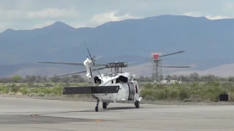 U.S. Navy MH-60 Seahawk with white paintwork taxiing at Naval Air Station Fallon Stock Footage 275824162